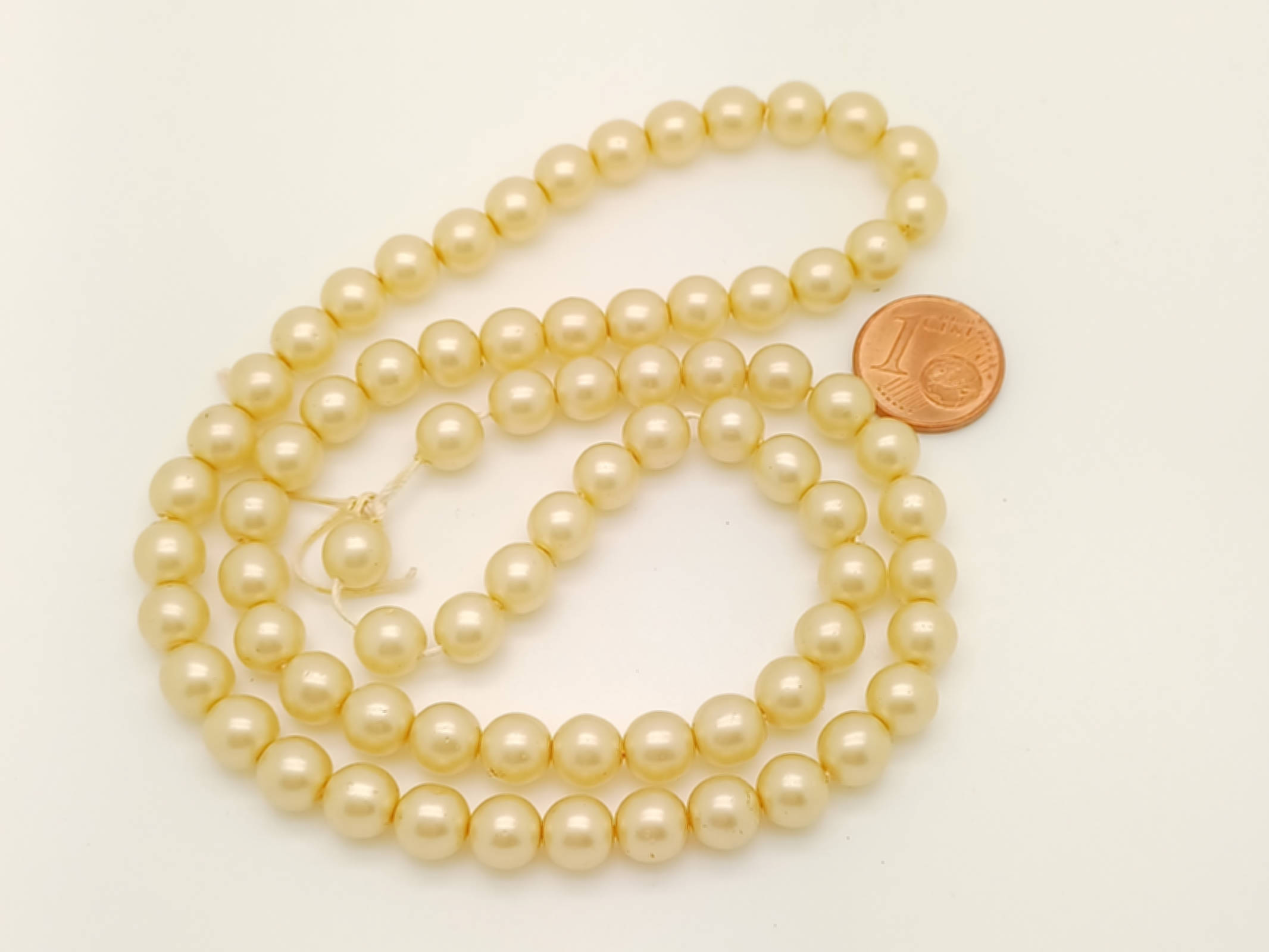 RES-09 perle ronde 7mm jaune dore