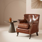 fauteuil-club-cuir-capitonné
