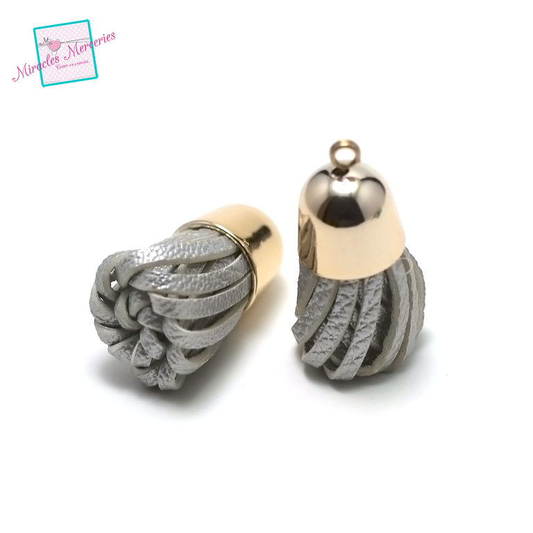 2 pompons en simili cuir 