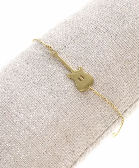 httpswww.labellesimonebijoux.frbraceletbracelet-mile-milabracelet-guitare-dore-avec-chaine-de-securite-pendentif-h0-80cm-l3-00cm-acier-inoxydable-mile-mila.html