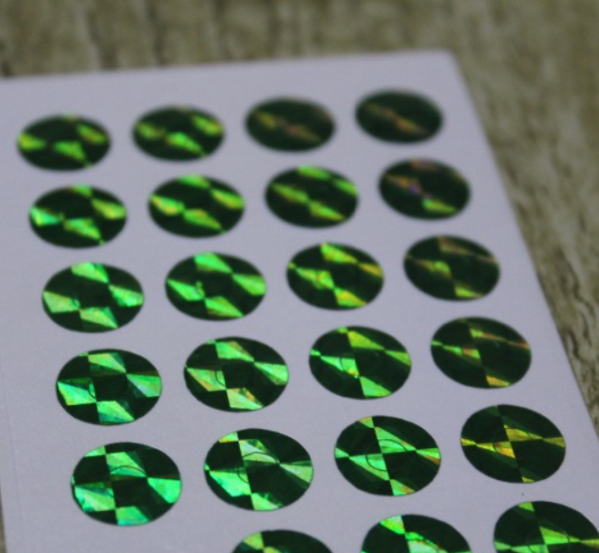 Disco - 24 petits oeillets papier vert