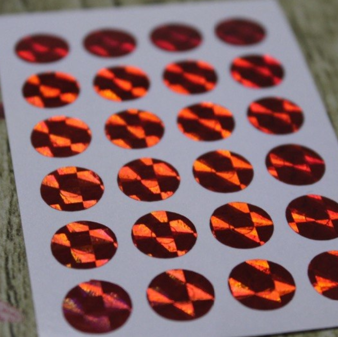 Disco - 24 petits oeillets papier rouge