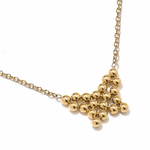 Collier en acier doré avec un papillon formé par plusieurs perles juxtaposées