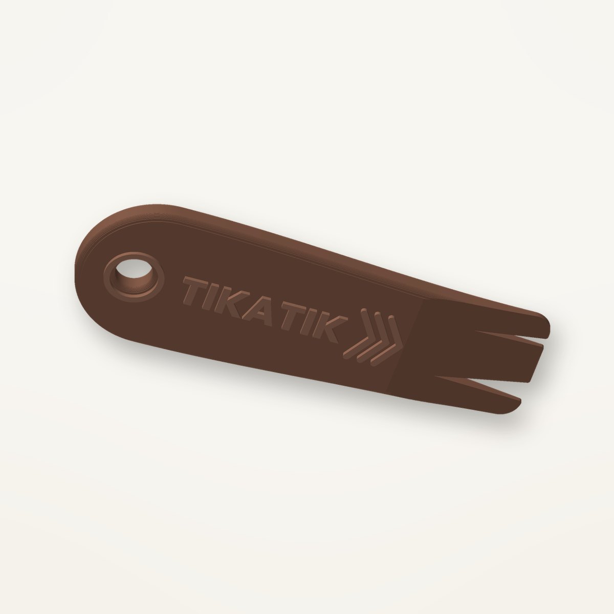 Tire-tique Tikatik marron avec écriture en relief