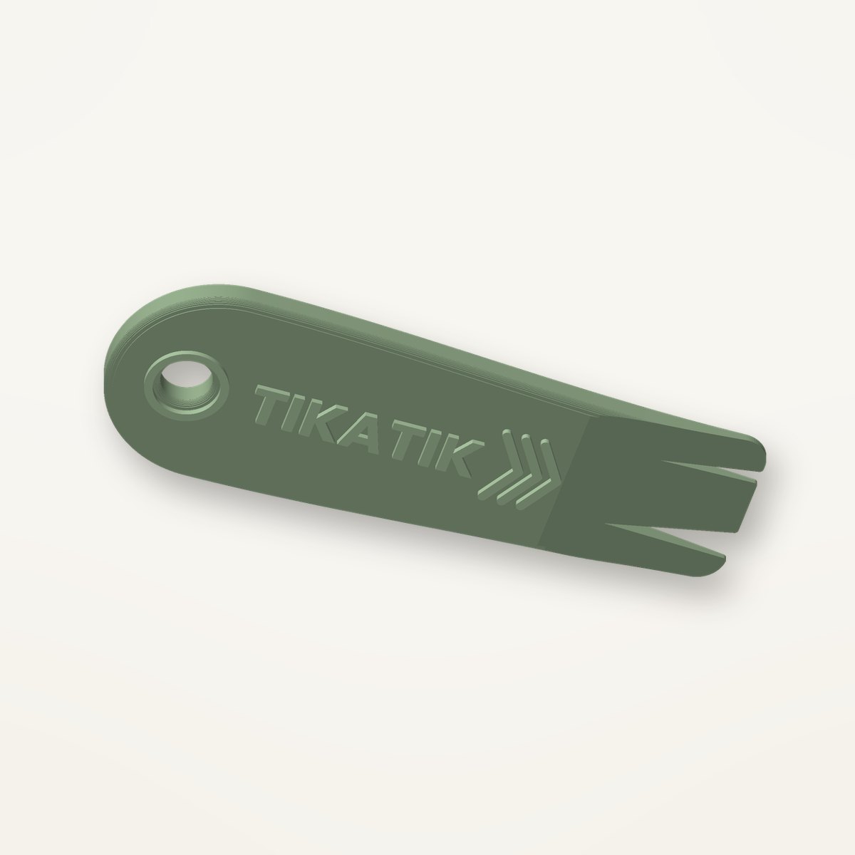Tire-tique Tikatik vert avec écriture en relief