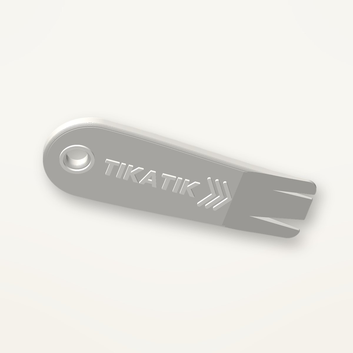 Tire-tique Tikatik blanc avec écriture en relief