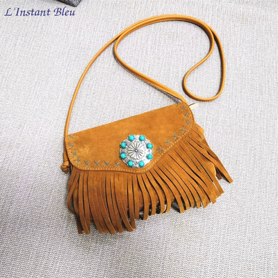 Sac-bijou à franges «Kāra» en Cuir et nubuck