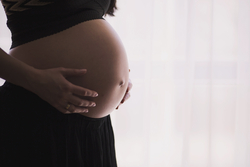 Canva - Belly of a Pregnant Woman