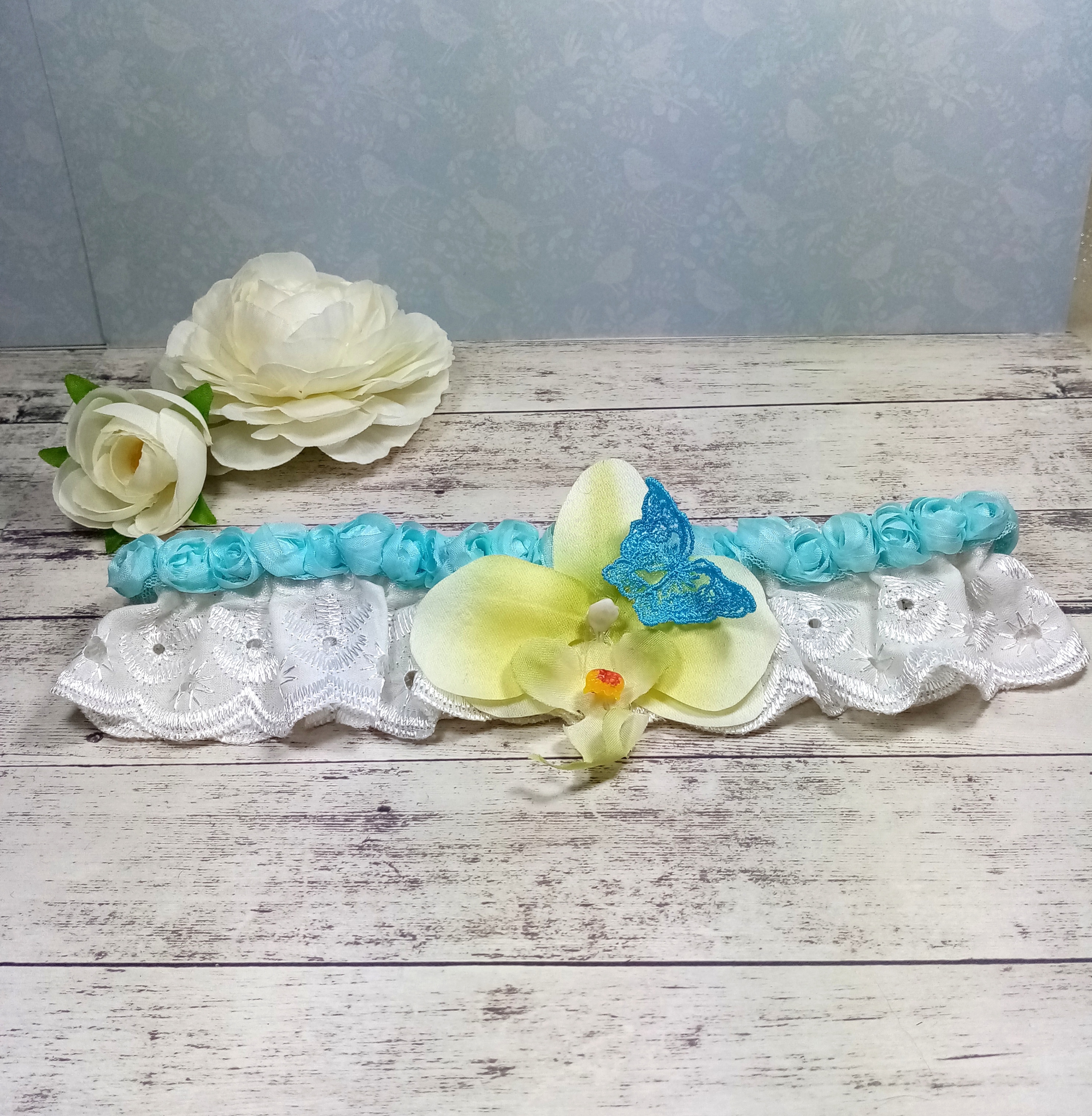 Jarretière de mariée Orchidée turquoise mariage papillon