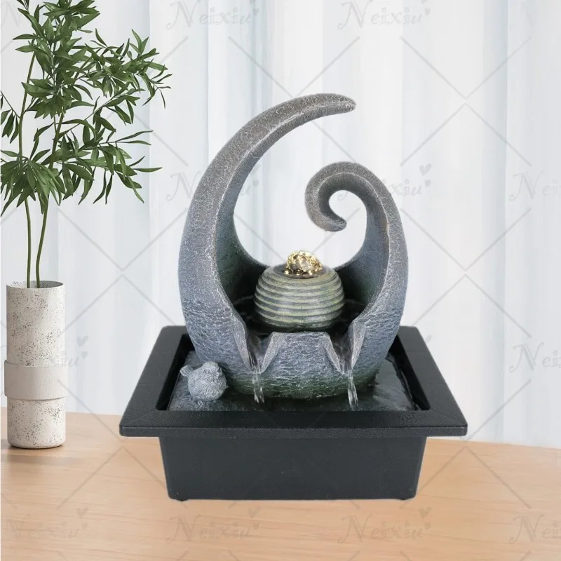 fontaine à eau design spirale et oiseau
