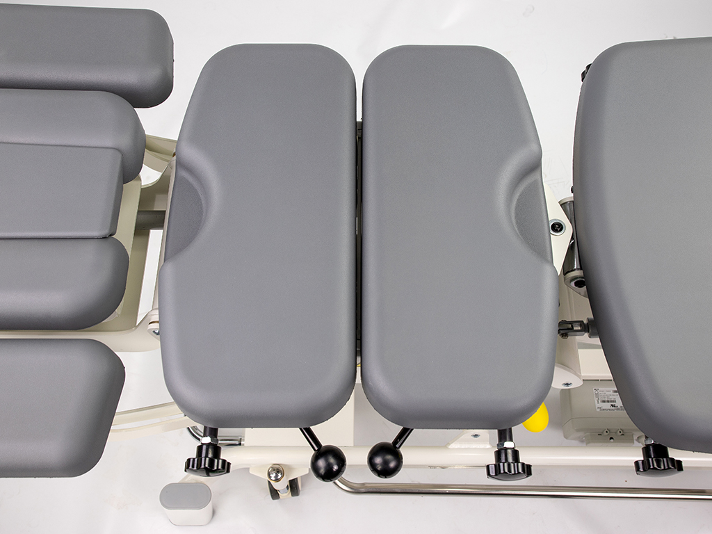 table de chiropraxie électrique habys avec drops ou toggle mécaniques vue jonction bassin dos couleur grise