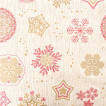 Gros plan des flocons dorés et rouges sur étoiles filantes de la nappe effet tissu