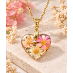 Collier fleur avec pendentif cœur en résine et chaîne dorée